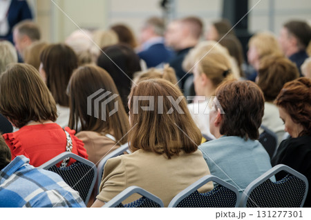 Audience gathered at a formal educational training event in a conference setting 131277301