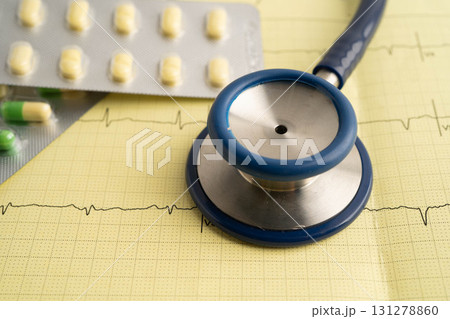 Stethoscope on electrocardiogram ECG with drug, heart wave, heart attack, cardiogram report. Stethoscope on electrocardiogram ECG with drug, heart wave, heart attack, cardiogram report. 131278860