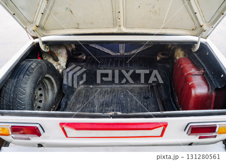 retro car with an open trunk and a spare tire inside retro car with an open trunk and a spare tire inside 131280561