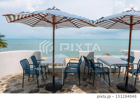 Outdoor lunch table at restaurant terrace by Pattaya beach, Chonburi 131284048