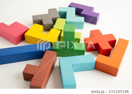 Logical thinking and problem solving problem solution creative business, wooden puzzle geometric block shape. Logical thinking and problem solving problem solution creative business, wooden puzzle geometric block shape. 131285198