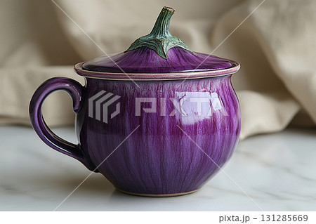 Ceramic cup with lid in shape of a purple eggplant in a rustic style on a white background. 131285669