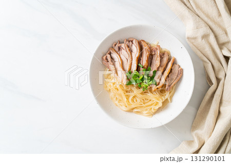 dried noodles with stewed duck in white bowl dried noodles with stewed duck in white bowl 131290101