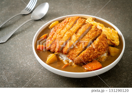 curry rice with fried pork cutlet and creamy omelet curry rice with fried pork cutlet and creamy omelet 131290120