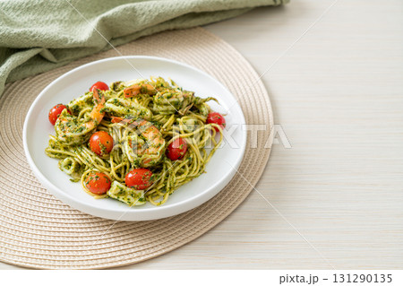 Spaghetti with seafood in homemade pesto sauce Spaghetti with seafood in homemade pesto sauce 131290135
