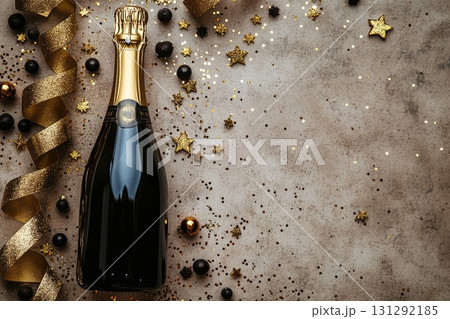Champagne bottle with golden festive decorations Champagne bottle with golden festive decorations 131292185