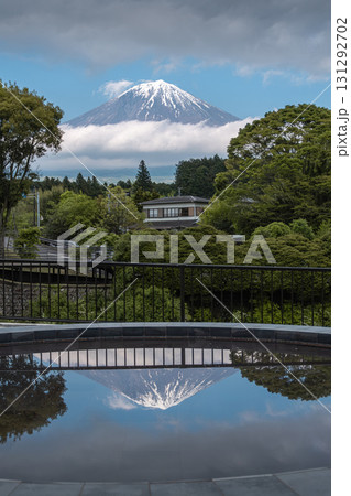 Snow capped Fuji mountain viewed from garden with reflective water pool in foreground, view from Shiraito park Snow capped Fuji mountain viewed from garden with reflective water pool in foreground, view from Shiraito park 131292702