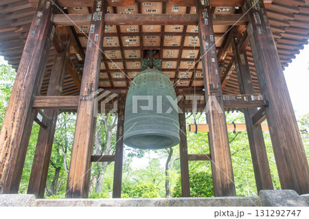 Tokyo, Japan - May 6, 2024: Large traditional Japanese temple bell hanging in wooden pavilion outdoors 131292747
