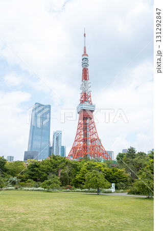 Tokyo Tower standing tall in city park with modern skyscrapers in background at Tokyo, Japan Tokyo Tower standing tall in city park with modern skyscrapers in background at Tokyo, Japan 131292847