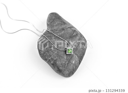 A necklace is on a rock 131294339
