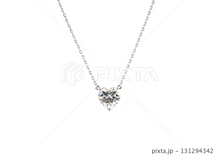 A heart shaped pendant with a diamond in the center A heart shaped pendant with a diamond in the center 131294342