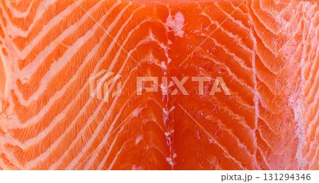 Closeup of fresh salmon highlighting the texture of the meat Closeup of fresh salmon highlighting the texture of the meat 131294346