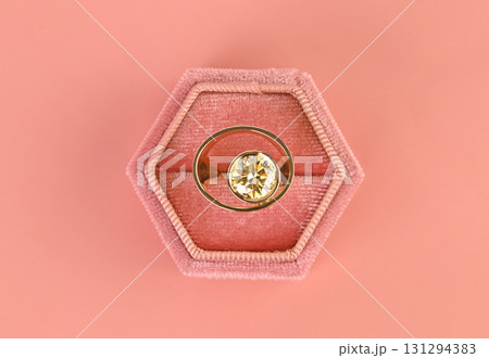A ring is in a pink velvet box A ring is in a pink velvet box 131294383