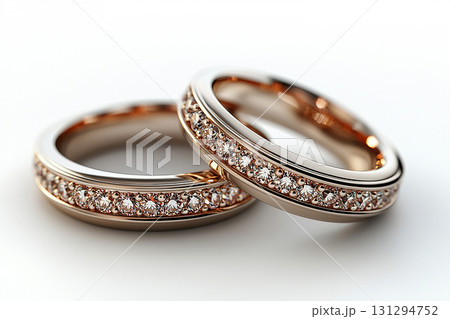 Pair of white gold wedding rings on a white background. 131294752