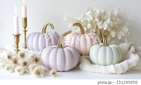 Blush pink and mint pumpkins styled with soft fabrics for modern spooky decor. 131295050