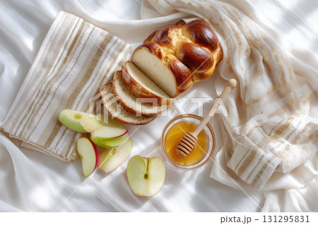 Traditional items for Jewish holiday arranged on white fabric, perfect for seasonal editorial Traditional items for Jewish holiday arranged on white fabric, perfect for seasonal editorial 131295831