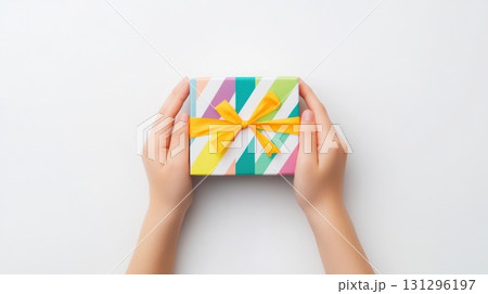 Hands opening colorful blind box on white background, close-up moment of unboxing with emotional tension, perfect for surprise toy themes 131296197