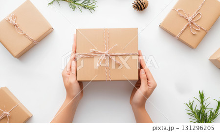 Hands opening mystery toy on white with clean visual style. Ideal for collectors and unboxing themes. 131296205