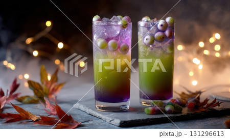 Halloween-themed punch with floating eyeballs and gummy worms, shot with fog and moody light, perfect for party designs. 131296613