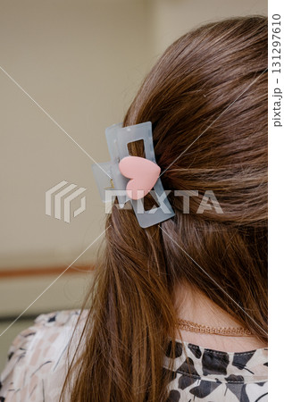 Hair accessories. A soft blue hair clip with a pink heart. 131297610