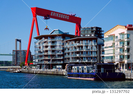 Eriksberg area on Hisingen in Gothenburg, former shipyard with big gantry crane near Alvsborg bridge, Sweden, sunny summer day Eriksberg area on Hisingen in Gothenburg, former shipyard with big gantry crane near Alvsborg bridge, Sweden, sunny summer day 131297702