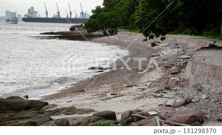 Sandy beach shoreline with calm sea. 131298370