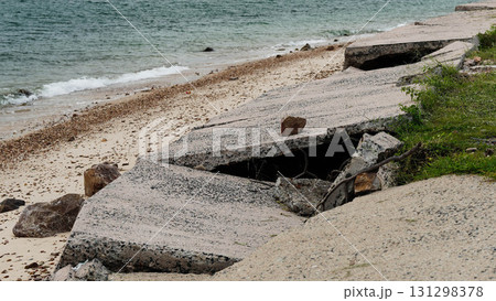 Destroyed road by coastal erosion Destroyed road by coastal erosion 131298378