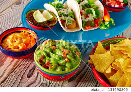 Fish tacos mexican food guacamole nachos and chili 131298806