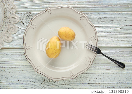 potatoes in white plate minimalist food concept 131298819