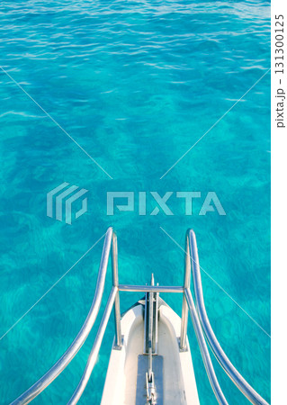 boat bow in transparent turquoise water boat bow in transparent turquoise water 131300125