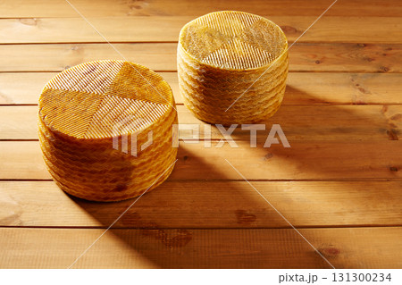 Manchego cheese from Spain in wooden table Manchego cheese from Spain in wooden table 131300234