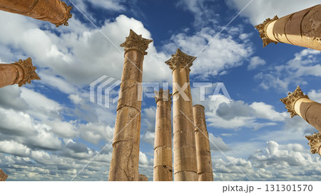 Roman Columns in the Jordanian city of Jerash (Gerasa of Antiquity), capital and largest city of Jerash Governorate, Jordan. Against the background of a beautiful sky with clouds 131301570