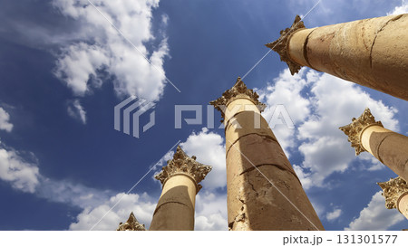 Roman Columns in the Jordanian city of Jerash (Gerasa of Antiquity), capital and largest city of Jerash Governorate, Jordan. Against the background of a beautiful sky with clouds 131301577