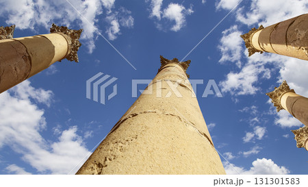 Roman Columns in the Jordanian city of Jerash (Gerasa of Antiquity), capital and largest city of Jerash Governorate, Jordan. Against the background of a beautiful sky with clouds Roman Columns in the Jordanian city of Jerash (Gerasa of Antiquity), capital and largest city of Jerash Governorate, Jordan. Against the background of a beautiful sky with clouds 131301583