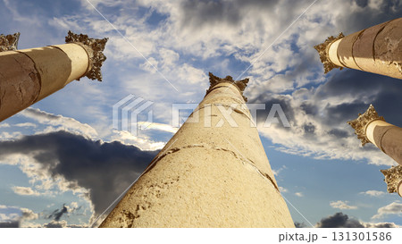 Roman Columns in the Jordanian city of Jerash (Gerasa of Antiquity), capital and largest city of Jerash Governorate, Jordan. Against the background of a beautiful sky with clouds Roman Columns in the Jordanian city of Jerash (Gerasa of Antiquity), capital and largest city of Jerash Governorate, Jordan. Against the background of a beautiful sky with clouds 131301586