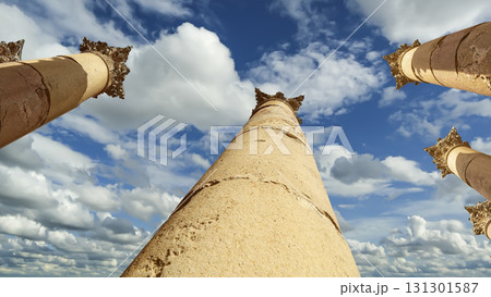 Roman Columns in the Jordanian city of Jerash (Gerasa of Antiquity), capital and largest city of Jerash Governorate, Jordan. Against the background of a beautiful sky with clouds Roman Columns in the Jordanian city of Jerash (Gerasa of Antiquity), capital and largest city of Jerash Governorate, Jordan. Against the background of a beautiful sky with clouds 131301587