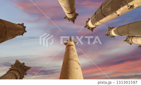 Roman Columns in the Jordanian city of Jerash (Gerasa of Antiquity), capital and largest city of Jerash Governorate, Jordan. Against the background of a beautiful sky with clouds Roman Columns in the Jordanian city of Jerash (Gerasa of Antiquity), capital and largest city of Jerash Governorate, Jordan. Against the background of a beautiful sky with clouds 131301597