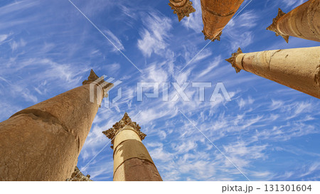 Roman Columns in the Jordanian city of Jerash (Gerasa of Antiquity), capital and largest city of Jerash Governorate, Jordan. Against the background of a beautiful sky with clouds 131301604