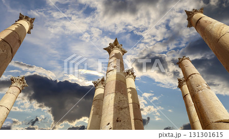 Roman Columns in the Jordanian city of Jerash (Gerasa of Antiquity), capital and largest city of Jerash Governorate, Jordan. Against the background of a beautiful sky with clouds 131301615