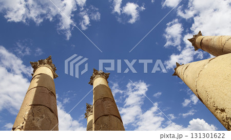 Roman Columns in the Jordanian city of Jerash (Gerasa of Antiquity), capital and largest city of Jerash Governorate, Jordan. Against the background of a beautiful sky with clouds 131301622