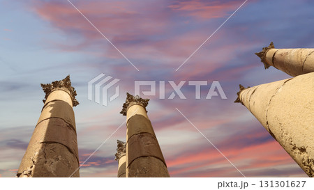 Roman Columns in the Jordanian city of Jerash (Gerasa of Antiquity), capital and largest city of Jerash Governorate, Jordan. Against the background of a beautiful sky with clouds 131301627