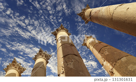 Roman Columns in the Jordanian city of Jerash (Gerasa of Antiquity), capital and largest city of Jerash Governorate, Jordan. Against the background of a beautiful sky with clouds 131301631