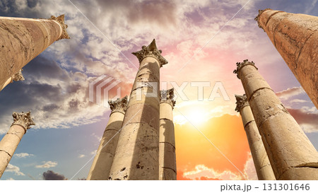 Roman Columns in the Jordanian city of Jerash (Gerasa of Antiquity), capital and largest city of Jerash Governorate, Jordan. Against the background of a beautiful sky with clouds 131301646