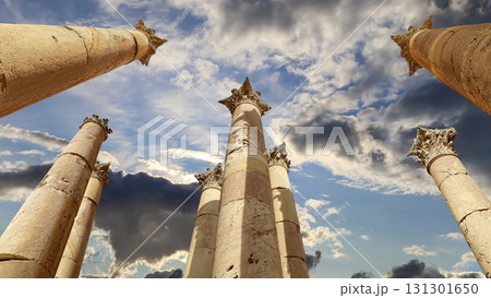 Roman Columns in the Jordanian city of Jerash (Gerasa of Antiquity), capital and largest city of Jerash Governorate, Jordan. Against the background of a beautiful sky with clouds 131301650