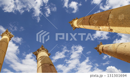 Roman Columns in the Jordanian city of Jerash (Gerasa of Antiquity), capital and largest city of Jerash Governorate, Jordan. Against the background of a beautiful sky with clouds Roman Columns in the Jordanian city of Jerash (Gerasa of Antiquity), capital and largest city of Jerash Governorate, Jordan. Against the background of a beautiful sky with clouds 131301694
