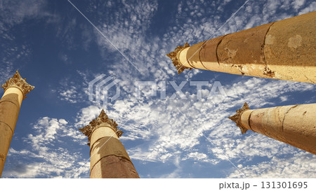 Roman Columns in the Jordanian city of Jerash (Gerasa of Antiquity), capital and largest city of Jerash Governorate, Jordan. Against the background of a beautiful sky with clouds Roman Columns in the Jordanian city of Jerash (Gerasa of Antiquity), capital and largest city of Jerash Governorate, Jordan. Against the background of a beautiful sky with clouds 131301695