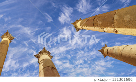 Roman Columns in the Jordanian city of Jerash (Gerasa of Antiquity), capital and largest city of Jerash Governorate, Jordan. Against the background of a beautiful sky with clouds Roman Columns in the Jordanian city of Jerash (Gerasa of Antiquity), capital and largest city of Jerash Governorate, Jordan. Against the background of a beautiful sky with clouds 131301696