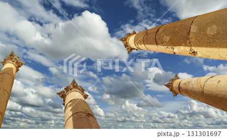 Roman Columns in the Jordanian city of Jerash (Gerasa of Antiquity), capital and largest city of Jerash Governorate, Jordan. Against the background of a beautiful sky with clouds Roman Columns in the Jordanian city of Jerash (Gerasa of Antiquity), capital and largest city of Jerash Governorate, Jordan. Against the background of a beautiful sky with clouds 131301697