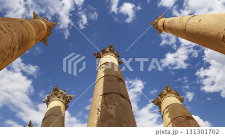 Roman Columns in the Jordanian city of Jerash (Gerasa of Antiquity), capital and largest city of Jerash Governorate, Jordan. Against the background of a beautiful sky with clouds 131301702