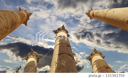Roman Columns in the Jordanian city of Jerash (Gerasa of Antiquity), capital and largest city of Jerash Governorate, Jordan. Against the background of a beautiful sky with clouds 131301705